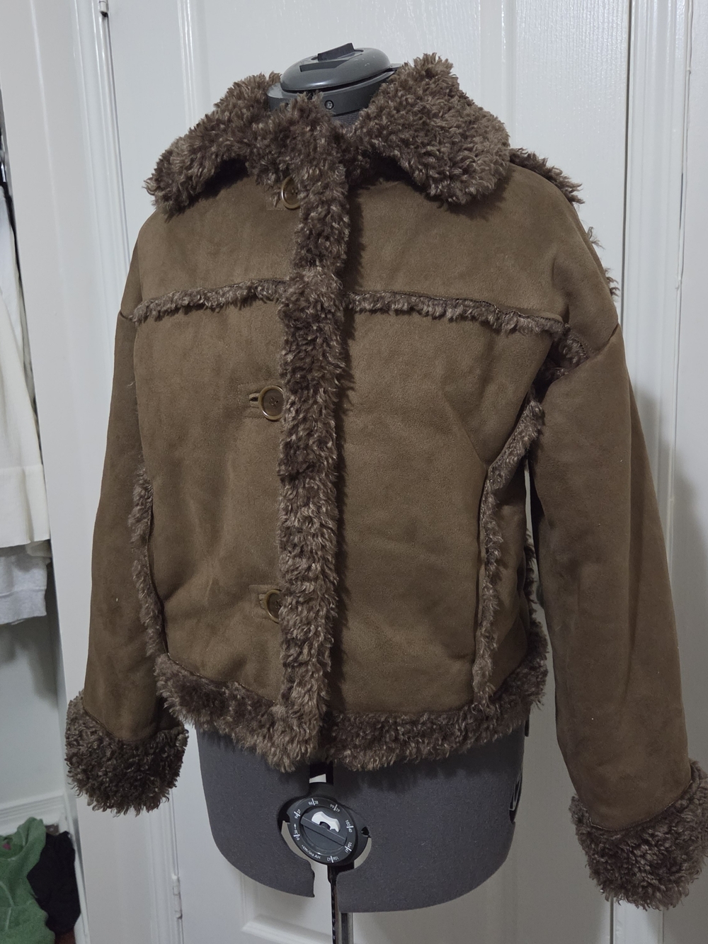 Subdued brown suede jacket with faux fur trim